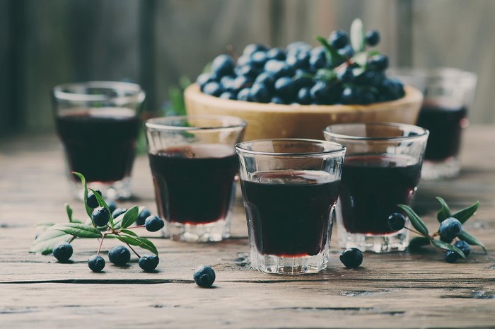 Blueberry liqueur shots with fresh berries