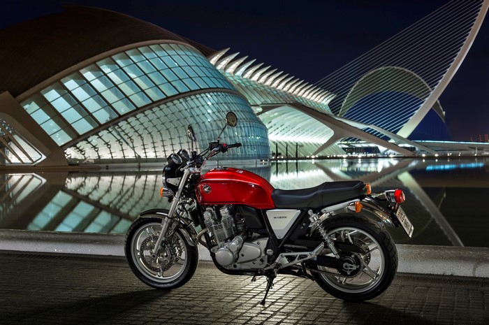 Red Honda CB1100 Motorcycle in front of modern architecture