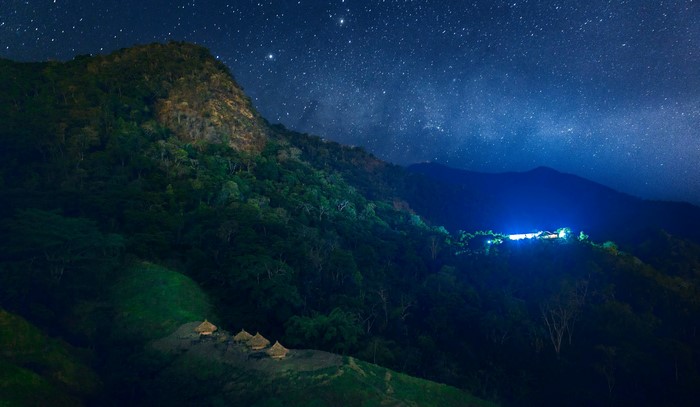 Night sky over mountains and forest in Mundo Nuevo, Argentina