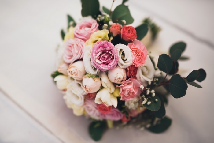 Bouquet of pink and white roses with eucalyptus