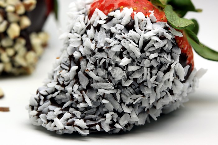 Chocolate-covered strawberry with coconut
