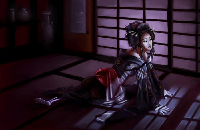 Geisha in traditional kimono lying on tatami floor