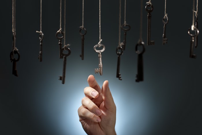 Hand reaching for hanging keys