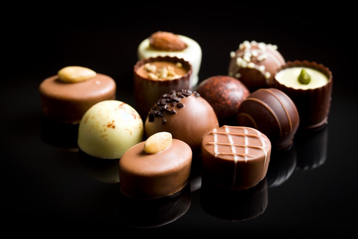 Assortment of chocolates on a black background
