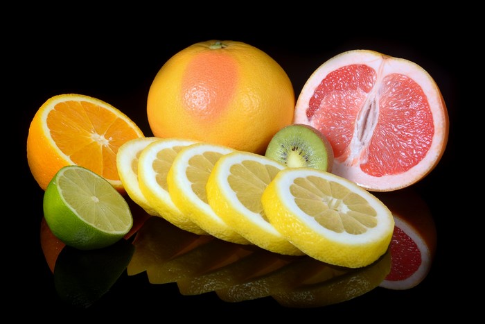 Citrus fruits: Grapefruit, orange, lemons, lime, and kiwi slices