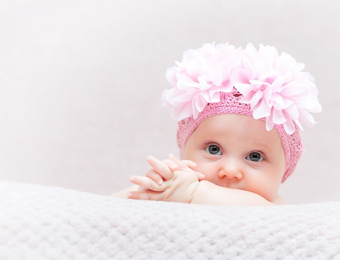 Baby girl wearing a pink floral hat