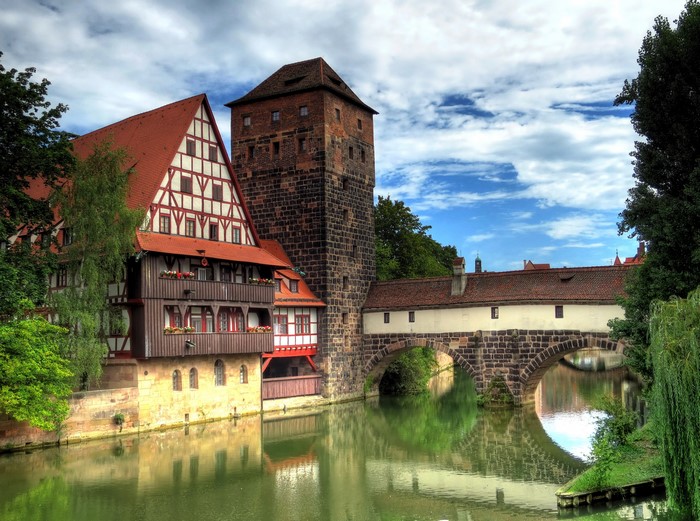 Half-timbered houses and tower over a river in Nuremberg, Germany