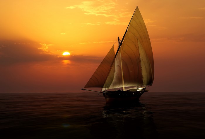 Sailboat on the sea at sunset