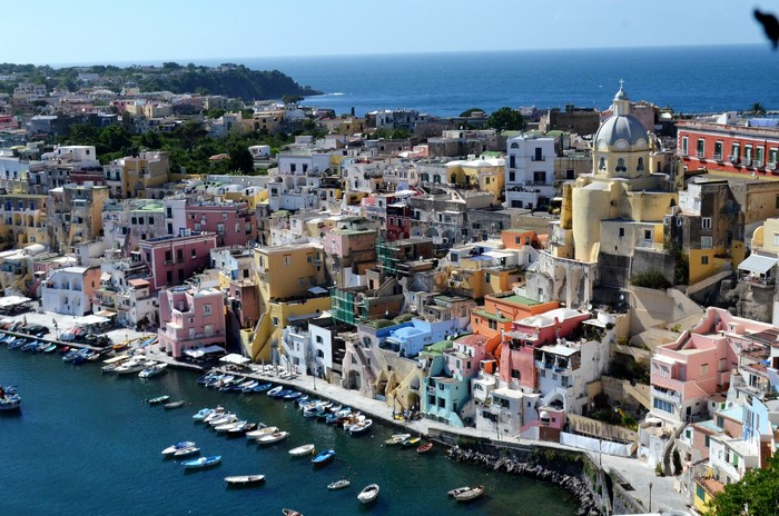 Colorful houses and boats in Marina Corricella, Procida, Italy