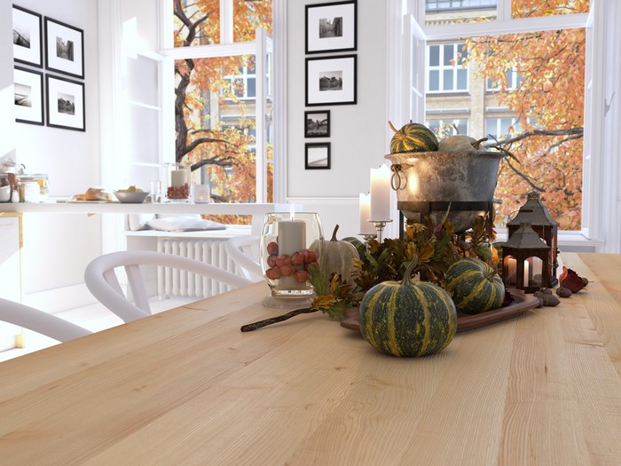 Autumnal dining room with pumpkins and fall foliage