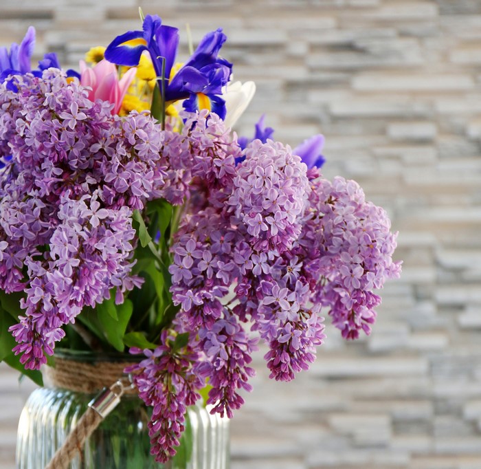 Bouquet of Lilacs and Irises in a Glass Vase