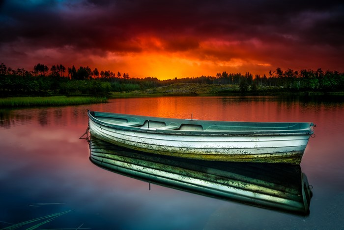 Boat on a lake at sunset