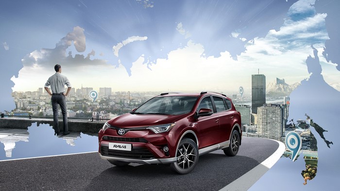 Toyota RAV4 on a world map background