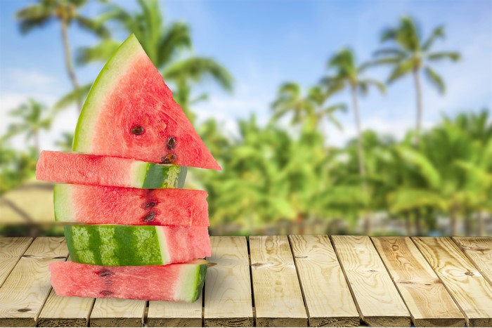 Stack of Watermelon Slices on Wooden Planks