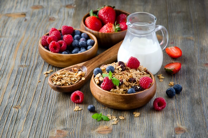 Muesli with Berries and Milk in Jug