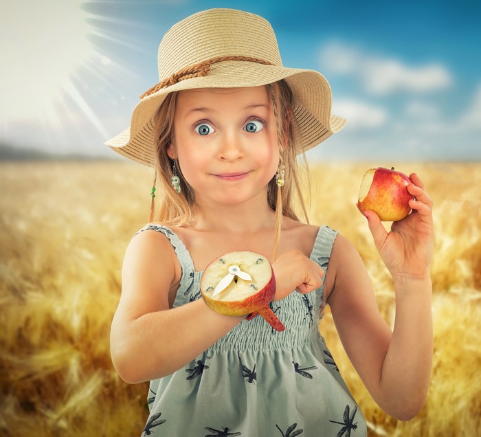 Girl with Apple Watch in Wheat Field
