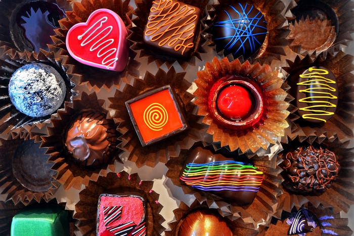 Assortment of chocolates in paper cups
