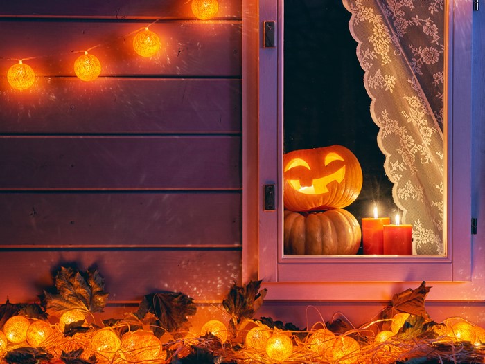 Halloween pumpkins and candles with fairy lights