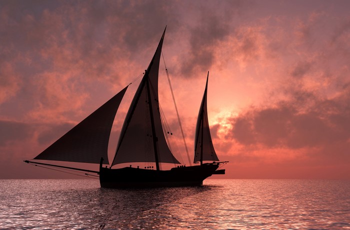 Sailboat on the sea at sunset