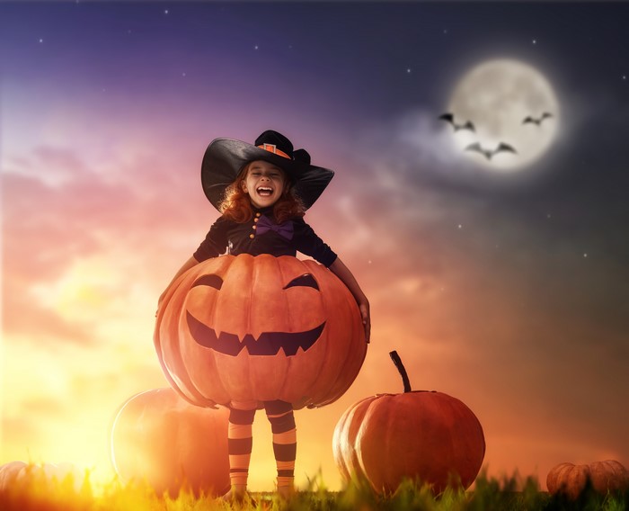 Girl in Pumpkin Costume on Halloween Night