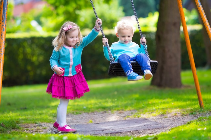 Two Children on a Swing Set