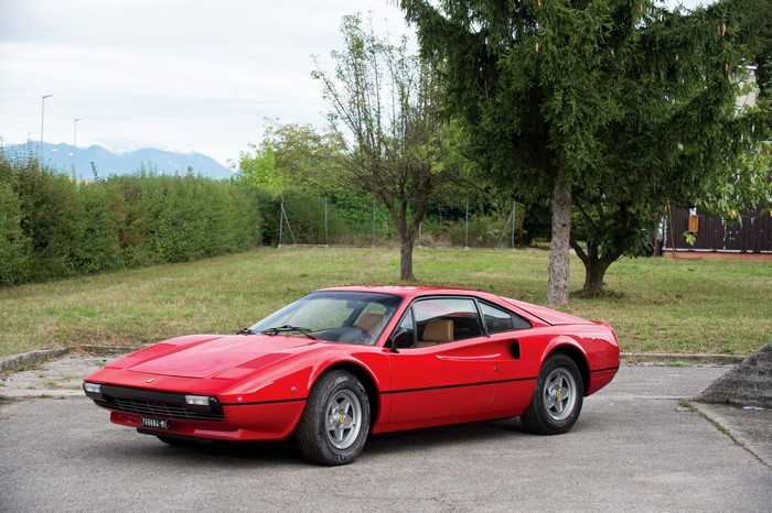 Red Ferrari 308 GTB parked outdoors