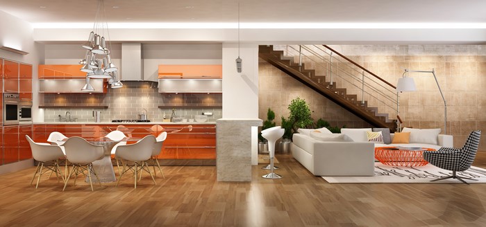 Modern open-plan living room and kitchen with orange cabinets