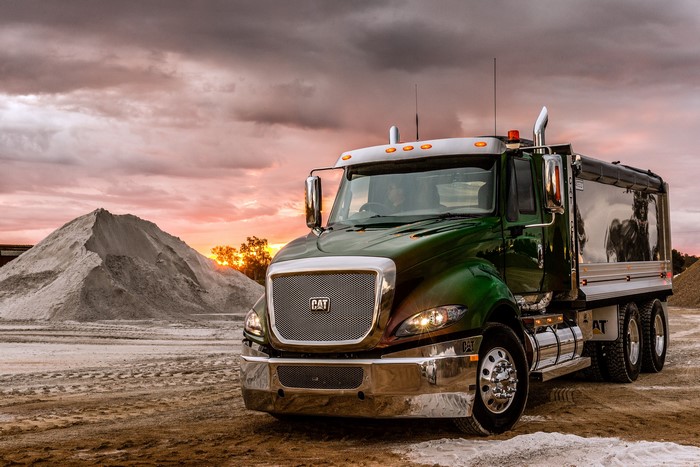 Caterpillar CT630 dump truck at sunset
