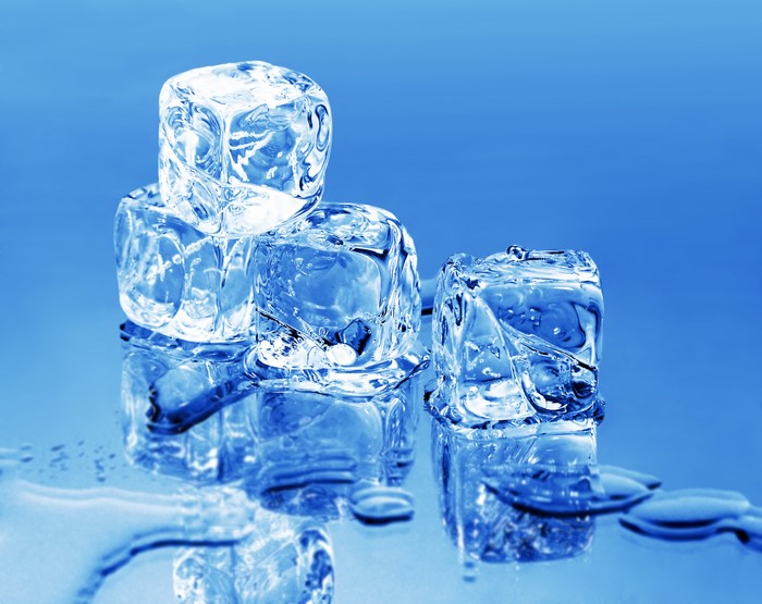Ice cubes on a blue background