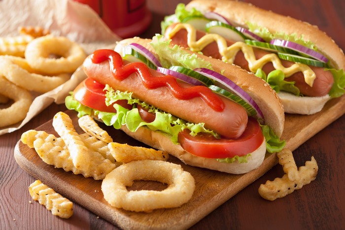 Hot dogs with french fries and onion rings