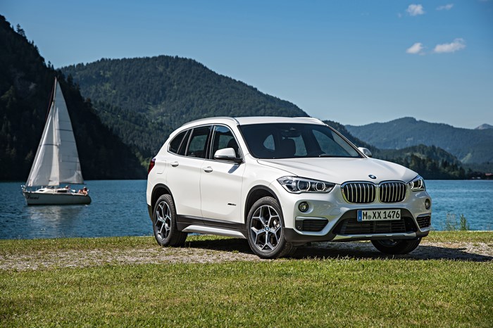 White BMW X1 xDrive F48 by a Lake