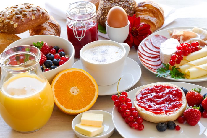 Breakfast with Juice, Coffee, and Fruits