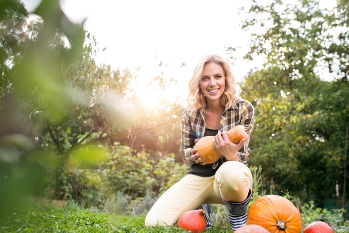 Blonde girl with pumpkins