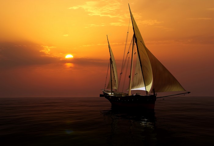 Sailboat on the sea at sunset