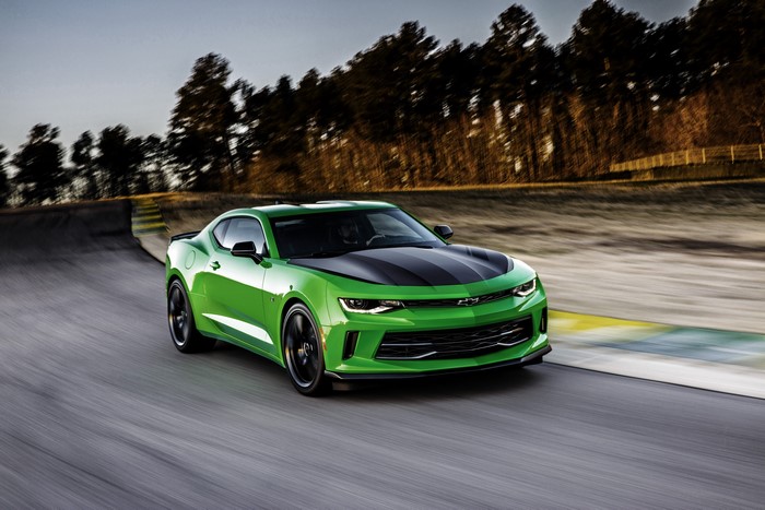 Green Chevrolet Camaro on a Racetrack