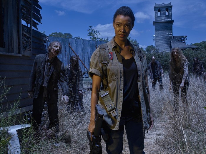Sasha from The Walking Dead with zombies