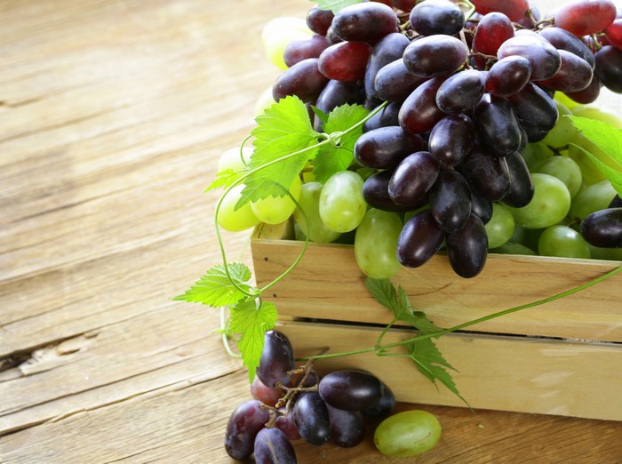 Grapes in a wooden crate