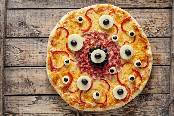 Halloween pizza with olives and peppers