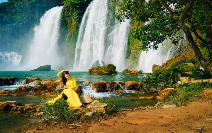 Woman in Yellow Ao Dai at Ban Gioc Waterfall