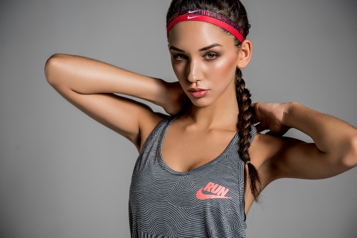 Woman with braid hair wearing Nike singlet