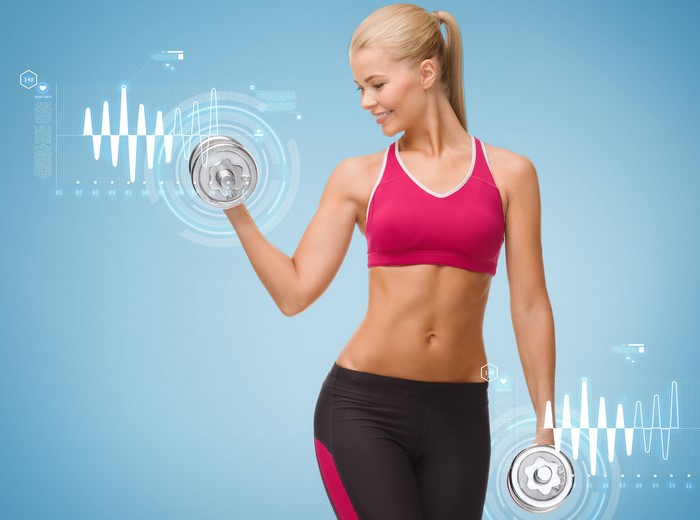Woman exercising with dumbbells and fitness data