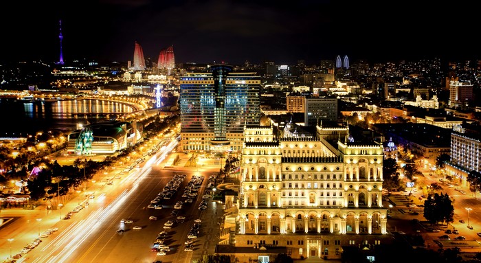 Night view of Baku, Azerbaijan with illuminated buildings and traffic