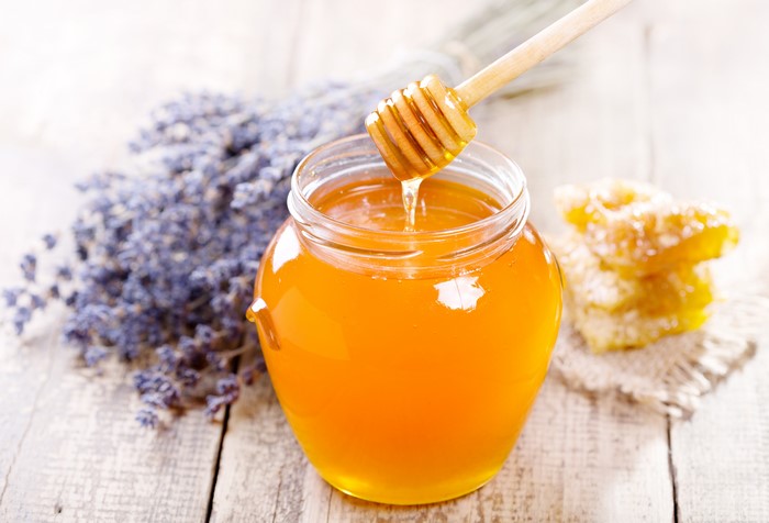 Honey jar with lavender and honeycomb