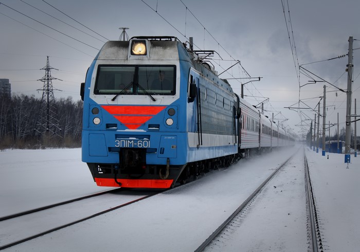 Blue and red electric locomotive in winter