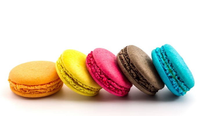 Assortment of colorful macarons on a white background