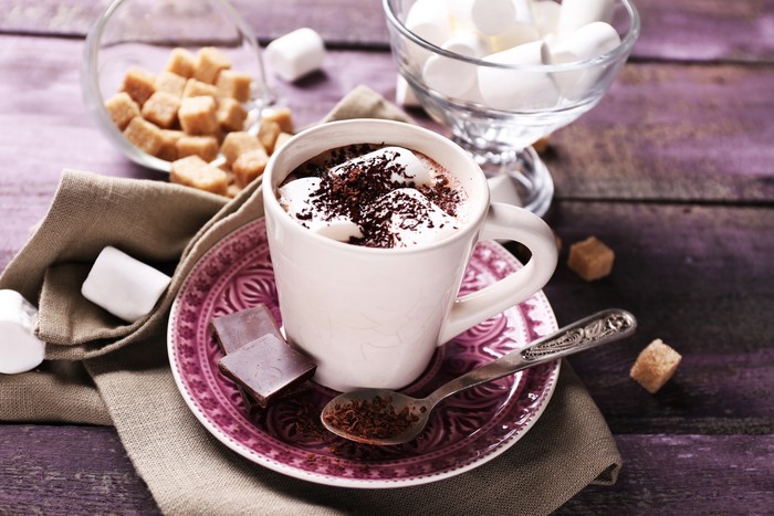 Hot chocolate with marshmallows, chocolate, and sugar cubes