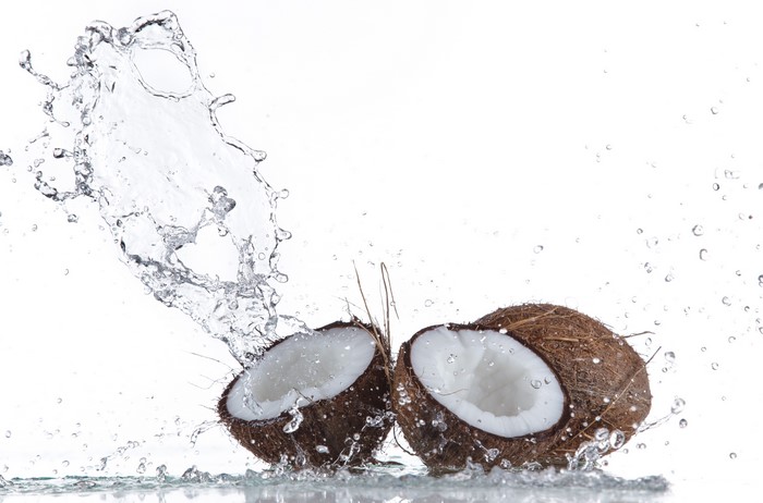 Coconuts with Water Splash on White Background