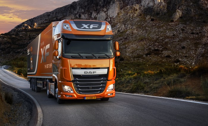 Orange DAF XF Euro 6 Truck on Mountain Road