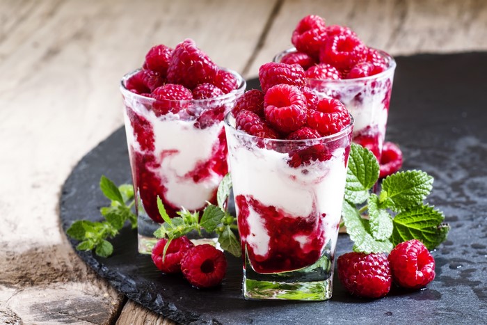 Raspberry and cream desserts in glasses