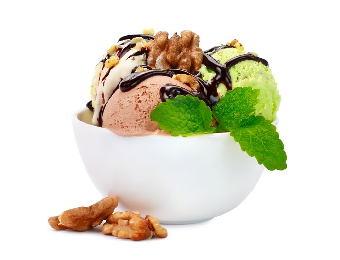 Ice cream scoops with chocolate, nuts, and mint